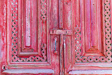 Old Cairo, Cairo, Egypt. Decorative woodwork on a weathered antique door.