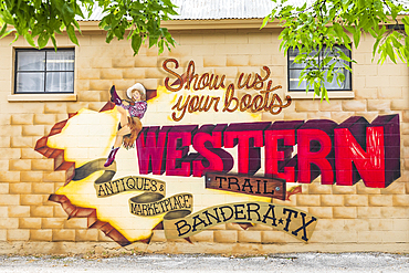 Bandera, Texas, USA. April 14, 2021. Mural featuring a cowgirl on a wall Texas.