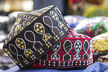 Dushanbe, Tajikistan. Prayer caps for sale at the Mehrgon Market in Dushanbe.