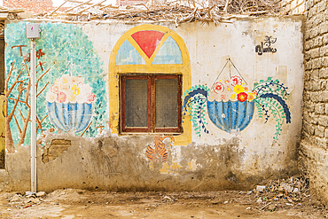 Faiyum, Egypt. February 19, 2022. Building decorated with murals in the village of Faiyum.