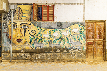 Faiyum, Egypt. February 19, 2022. Building decorated with murals in the village of Faiyum.