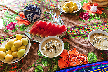 Margib, Sughd Province, Tajikistan. Fresh fruit and noodle soup at a mountain guest house.