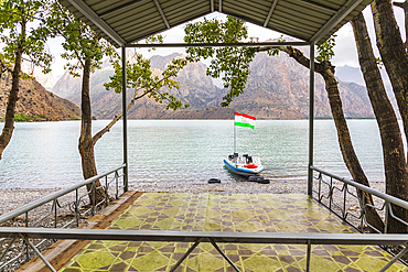 Iskanderkul, Sughd Province, Tajikistan. August 15, 2021. Boat with the Tajik flag on Iskanderkul Lake. Editorial Use Only