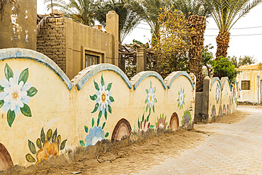 Faiyum, Egypt. February 19, 2022. Wall decorated with murals in the village of Faiyum.