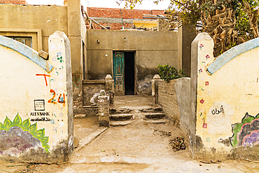 Faiyum, Egypt. February 19, 2022. Wall decorated with murals in the village of Faiyum.