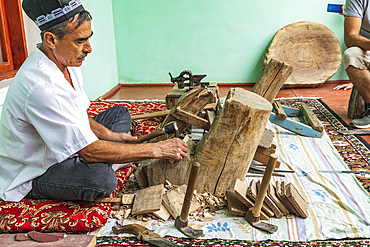 Istaravshan, Sughd Province, Tajikistan. August 19, 2021. Craftsman making wooden combs in Istaravshan. Editorial Use Only