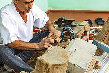 Istaravshan, Sughd Province, Tajikistan. August 19, 2021. Craftsman making wooden combs in Istaravshan. Editorial Use Only