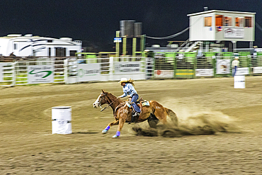 USA, Washington State, Whitman County. Palouse. Palouse Empire State Fair. Colfax. September 9, 2021. Barrel racing at a country fair rodeo.