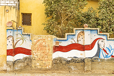 Faiyum, Egypt. February 19, 2022. Wall decorated with murals in the village of Faiyum.