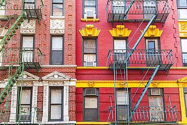 Chinatown, Manhattan, New York City, New York, USA. Fire escapes on buildings in Chinatown.