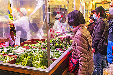 Chinatown, Manhattan, New York City, New York, USA. November 3, 2021. Shopping for vegetables in Chinatown.