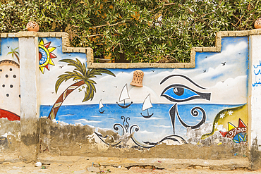 Faiyum, Egypt. February 19, 2022. Wall decorated with murals in the village of Faiyum.