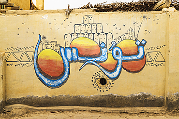 Faiyum, Egypt. February 19, 2022. Wall decorated with murals in the village of Faiyum.