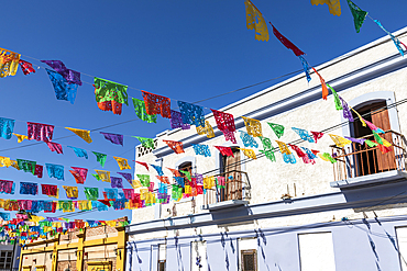 Todos Santos, Baja California Sur, Mexico. Festive colorful banners over a street in Todos Santos.