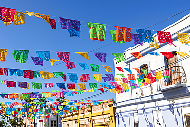 Todos Santos, Baja California Sur, Mexico. Festive colorful banners over a street in Todos Santos.