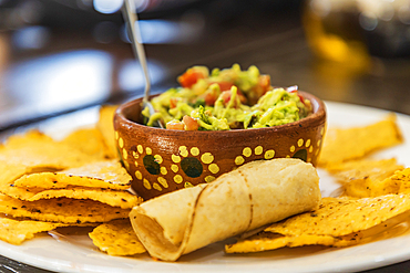 San Ignacio, Mulege, Baja California Sur, Mexico. Chips and guacamole in a cafe in San Ignacio.