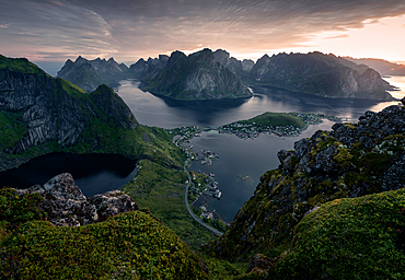 View from peak of Reinebringen above the Reine village of summer sunrise over Arctic Circle, in south part of Lofoten Islands, Norway, Europe