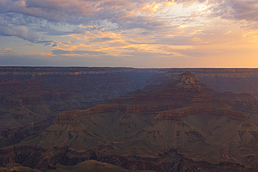 Golden light envelops the Grand Canyon during a summer sunrise, Tusayan, Arizona, United States of America, North America