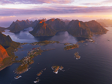 Amazing aerial view taken by drone of the Reine fjord during a sunrise, Reine, Moskenesoya, Lofoten Islands, Nordland, Norway, Scandinavia, Europe