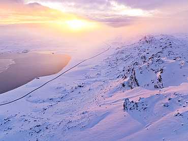 Aerial view taken by drone of the road that runs along Lake Kleifarvatn, during a magnificent winter sunset, Iceland, Polar Regions