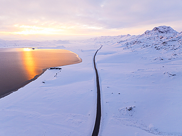 Aerial view by drone of the road that runs along Lake Kleifarvatn, during a magnificent winter sunset, Iceland, Polar Regions