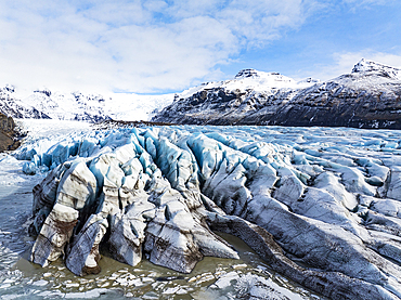 Aerial drone view of particular ice textures formed in the Svinafellsjokull glacier following global warming, Iceland, Polar Regions