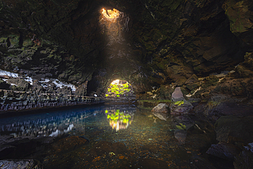 The interior beauty of Jameos del Agua with a ray of light, Haria, Las Palmas, Lanzarote, Canary Islands, Spain, Atlantic, Europe