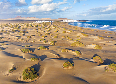 Aerial view of a tourist and sand dunes of Famara Beach during sunrise, Caleta de Famara, Las Palmas, Lanzarote, Canary Islands, Macaronesia, Spain, Western Europe