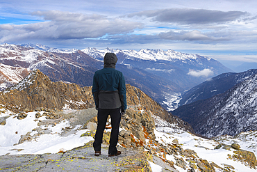 A man observes Cima Palù from Passo Paradiso at Tonale Pass, Trento, Trentino Alto Adige, Italy, Southern Europe