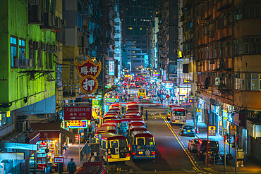 Tung choi street with typical buses during night, MongKok, Kowloon, Hong Kong, China, Asia