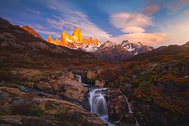 Escondida waterfall and Fitz Roy mountain in the background during sunrise, El Chalten, Parque Nacional Los Glaciares, Santa Cruz, Patagonia Argentina, Argentina, South America