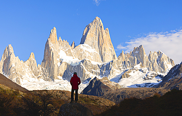 A tourist observes Fitz Roy mountain during sunrise, El Chalten, Parque Nacional Los Glaciares, Santa Cruz, Patagonia Argentina, Argentina, South America