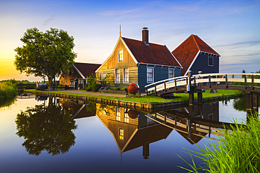 Zaanse Schans house during sunset in summer with reflections, Zaanstad, Zaandam, Netherlands, North Holland, Western Europe