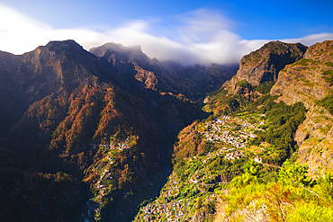 Aerial view from Eira do Serrado viewpoint of mountains and valley at sunset, Curral das Freiras, Camara de Lobos, Madeira region, Portugal, Europe