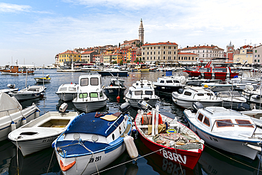 Boats in the harbor overlooking the old town of Rovinj, Croatia, Europe