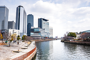 View Along the daini neya river banks with skyscrapers of Osaka Business Park. Osaka, Kansai, Japan