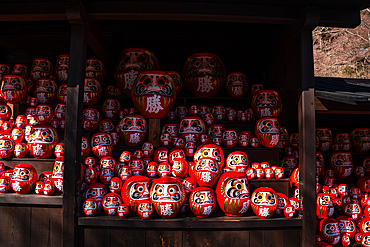 Frames filled with red daruma figures lucky charm of Shintoism .Katsuō-ji Temple in the Minoh National Park, Osaka, Kansai, Japan