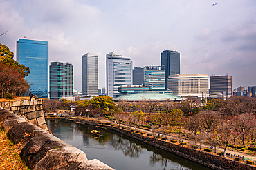 Overlooking the caste moat in front of the skyline of Osaka Business Park. Osaka Castle, Osaka, Kansai, Japan