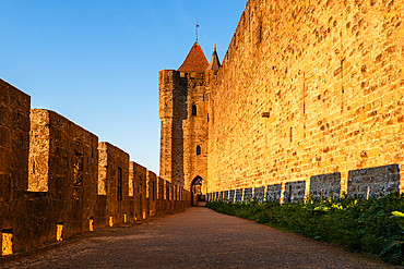 Long Stone Walkway Beside Fortress Walls in Carcassonne France. La Cite, Carcassonne medieval fortified town, Aude, Languedoc-Roussillon, France, Europe
