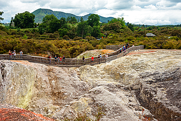 Walking paths through a volcano landscape in Waiotapu Thermal Wonderland, North Island, New Zealand