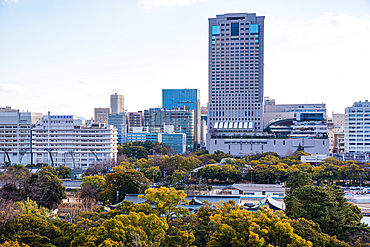 Urban Skyline of Hiroshima City with Office Buildings and Tree-Lined Rivers at Sunset, Viewed from Hiroshima Castle main tower Japan