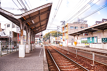 Empty Train Platform and Railway Tracks at Miyajimaguchi Station, the Gateway to Miyajima Island, Japan