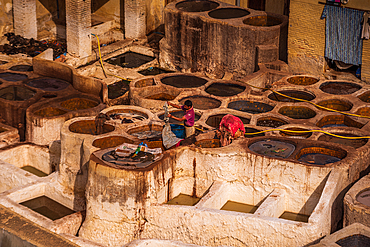 Two Women Working Over Dye-Filled Leather Vats at Chouara Tannery, Fes, Morocco