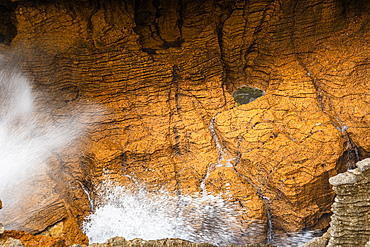 Powerful Sea Surge Through Blowhole in Honey-Colored Rock at Pancake Rocks, Punakaiki, West Coast, New Zealand