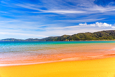 Golden Orange Beach and Turquoise Sea Under Blue Sky at Abel Tasman National Park, New Zealand