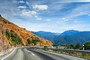 Sweeping Bend on Mountain Road Overlooking Valley and Peaks, South Island Landscape, New Zealand