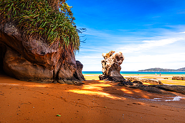 Scenic Rock Stack on Bright Orange Beach at Low Tide, Abel Tasman Coast, New Zealand