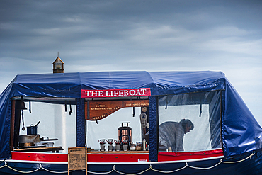 Mobile Lifeboat Café Stall with Nautical Decor on Cloudy Day, West Coast, New Zealand