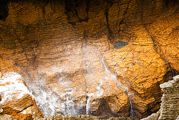 Golden Light on Eroded Honeycomb Limestone Cliffs at Pancake Rocks, West Coast, New Zealand