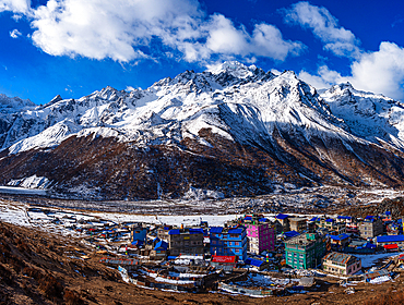 Panoramic View of Kyanjin Gompa Village with Colorful Rooftops Against Baden-Powell Peak in Snow-Covered Langtang Valley, Nepal